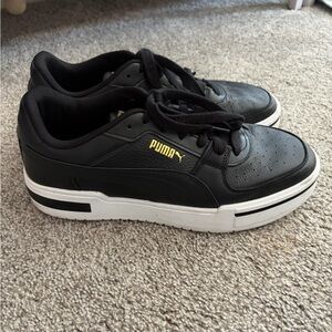 Puma Black Athletic Shoes with Gold Accents